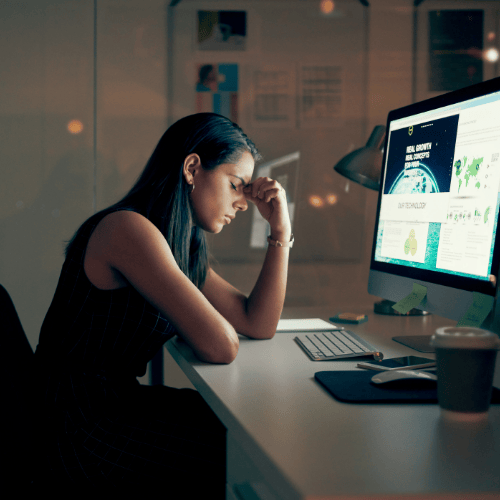 a woman frustrated in front of pc