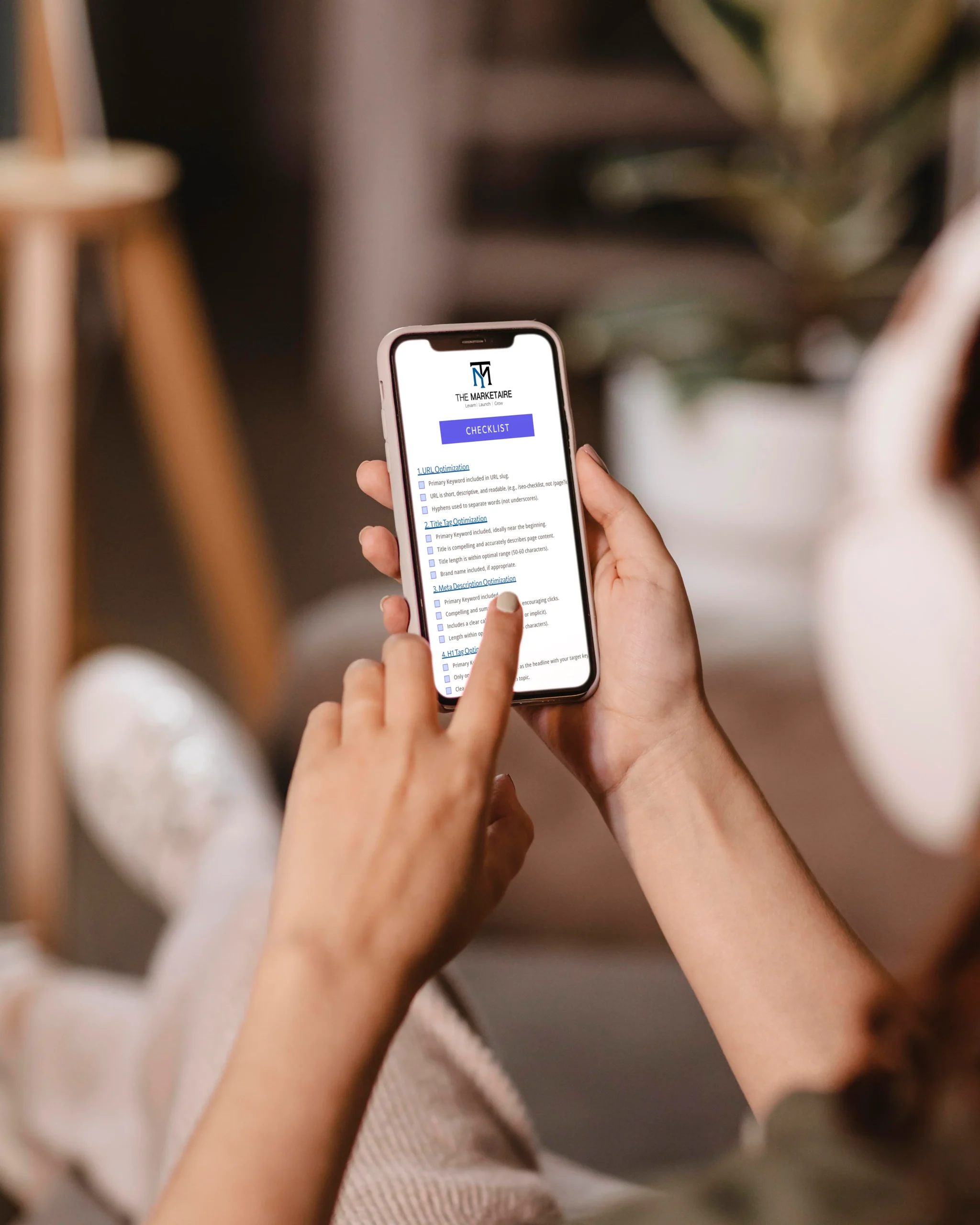 woman using smartphone reading the SEO checklist